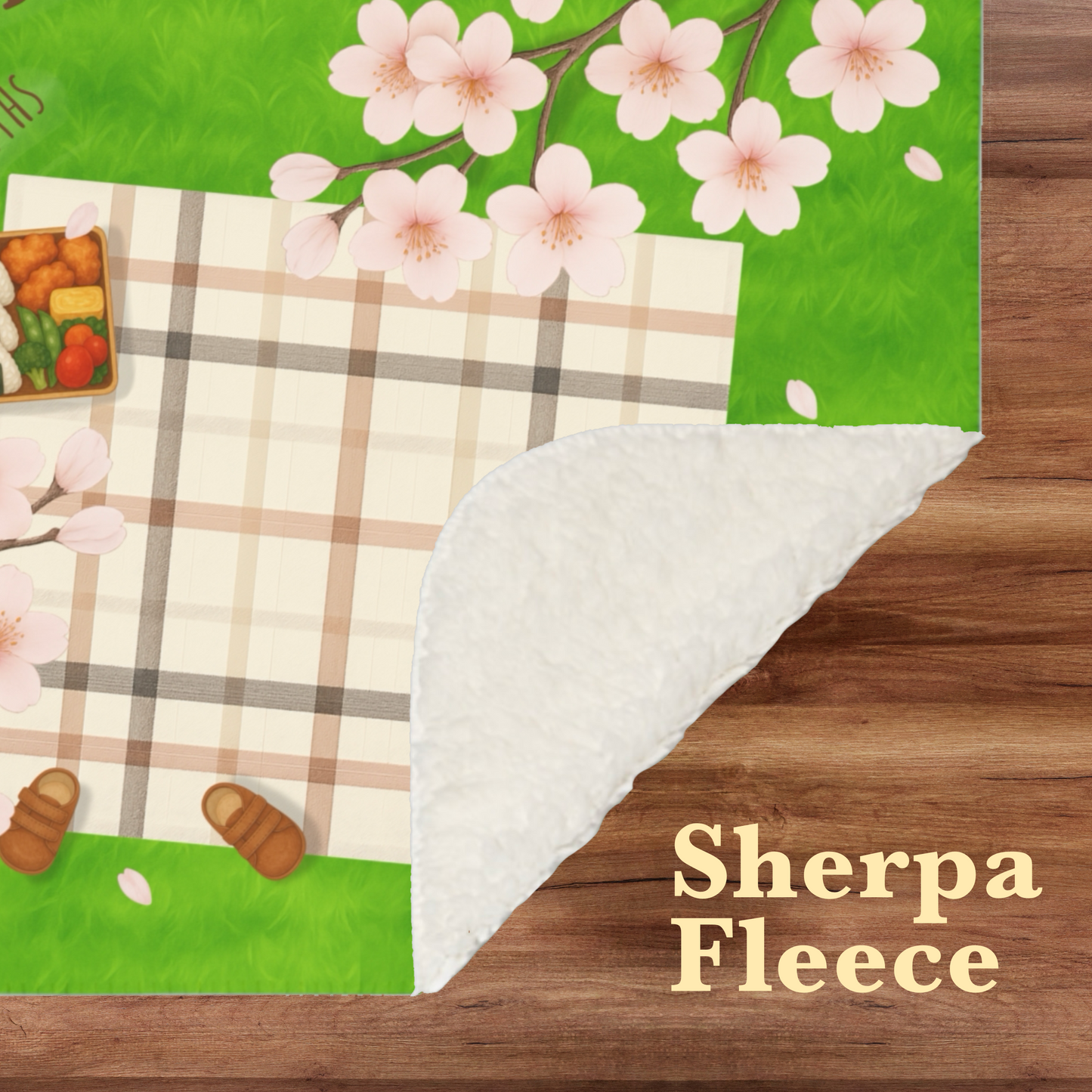 “Picnic-themed milestone blanket with sakura flowers, checkered picnic mat, bento lunch, and baby name tag, perfect for baby photos or baby shower gift.”