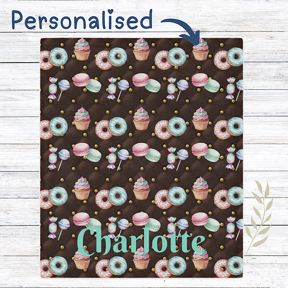 Chocolate colour Personalised throw blanket with sweet pattern on a wooden surface