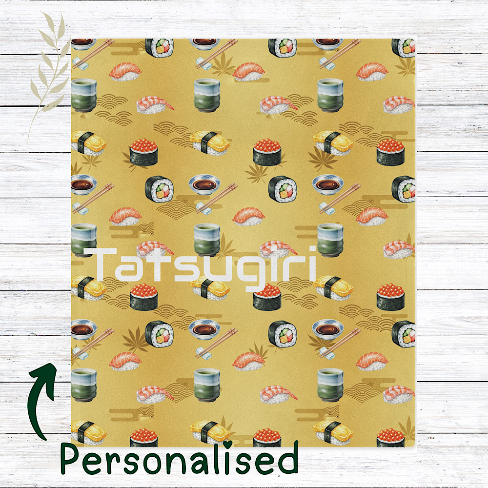 Personalised Sushi patterned gold colour throw blanket on a wooden surface