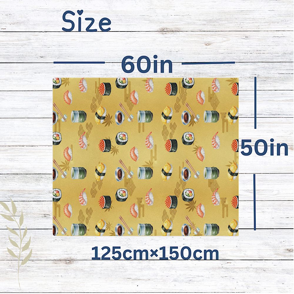 Gold throw blanket with sushi pattern and measurements on a wooden background