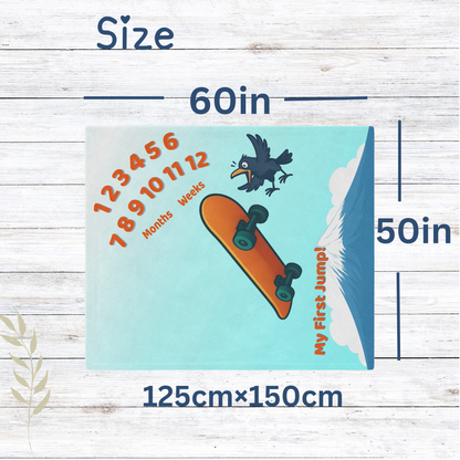“Skateboard-themed baby milestone blanket with bright orange board, excited cartoon bird, Mt. Fuji in the background, and ‘My First Jump!’ text. Sherpa fleece backing, perfect for weekly or monthly baby photo sessions.”
