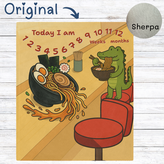 “Ramen shop-themed baby milestone blanket featuring a cute green crocodile eating noodles, with a spilled ramen bowl and sherpa fleece backing. Great for monthly or weekly baby photos.”
